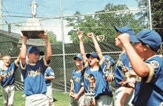 Members of Rotary celebrate their capture of the Portsmouth Herald City Little League Tournament trophy.