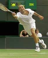 Andre Agassi stretches to return to Australia's Wayne Arthurs Monday during their fourth round match on the No. 1 Court at Wimbledon. Agassi won the match 6-7 (5-7), 7-6 (7-5), 6-1, 6-4.