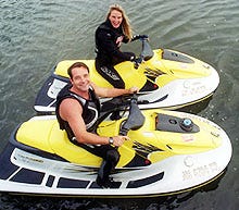 David McCrossin and Kimberly Florence of West Dennis sit on their personal watercraft in Bass River. The two are planning to travel to Detroit to raise funds for Big Brothers, Big Sisters of Cape Cod and for the children's trauma unit at Cape Cod Hospital.