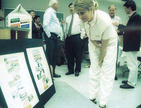 Cilla Temple, economic development manager for the city of Lake Wales, looks at the story board that were used to create a new ad campaign for Florida Natural.