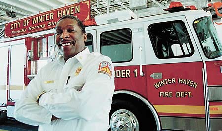 Winter Haven Fire Chief Tony Jackson stands in front of the Ladder one truck at the Winter Haven Fire Department's main station.