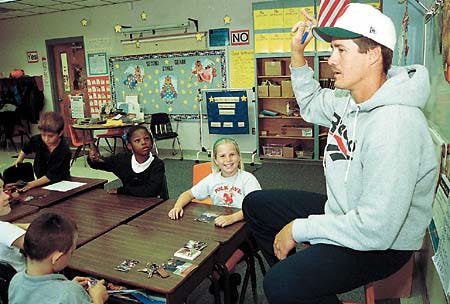 Pat Borders, a catcher for the Tornto Blue Jays and a lifelong resident of Lake Wales, talks to 2nd graders in Barbara Kinggry classroom at Polk Aveune Elementary Wednesday during the Great American Teach-in.