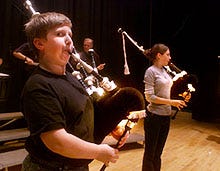 Chris Hamblin, 11, of Falmouth and Jill Limberakis of Woods Hole rehearse with their bagpipe group in Falmouth earlier this week.