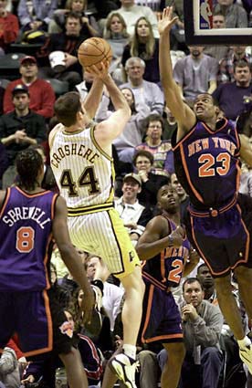Indiana Pacers' Austin Croshere (44) shoots over New York Knicks' Marcus Camby (23) during the second quarter Saturday in Indianapolis.