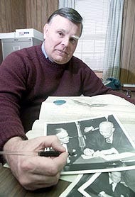 Dr. Richard LeJava of Hyannis holds a fountain pen used by President Dwight D. Eisenhower, along with original photos of Eisenhower using the pen and a document signed by President Abraham Lincoln.