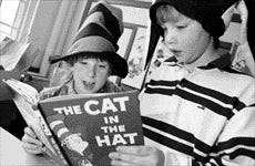 Fourth-graders Evelyn Brown 9, left, and Noah Gerson 9, read "The Cat in the Hat" at Kittery's Frisbee School.

Staff photo