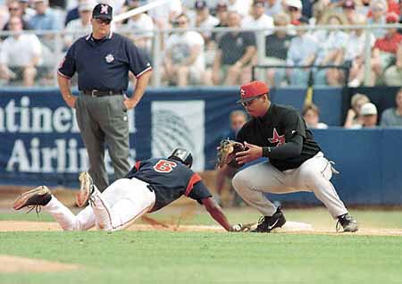 Cleveland's Jolbert Cabrera slides safely back to first during pickoff play Tuesday against the Houston Astros.