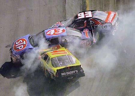 John Andretti (43) gets sandwiched by Dave Blaney (93) and Rick Mast (41) during the NASCAR Food City 500 at the Bristol Motor Speedway.