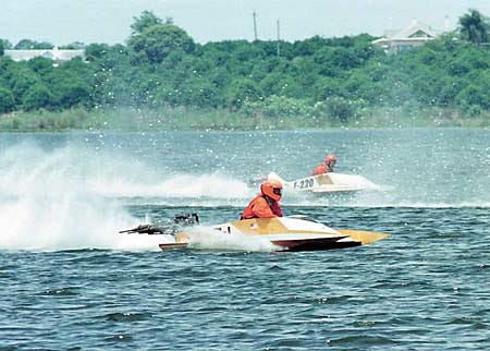 David Weaver, foreground, from North Carolina and Pete Hellsten from Edgewater skim across Lake Alfred at speeds approaching 90 mph during an early heat Saturday afternoon.