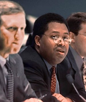 Reginald Brown, center, chairman of the Task Force on Privacy and Technology, comments during the panel's first meeting Friday, in Tallahassee, Fla. Dept. of Law Enforcement Commissioner James "Tim" Moore is shown at left.