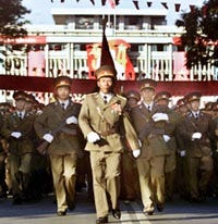 Vietnamese military officers march in front of the Reunification Palace in Ho Chi Minh City yesterday, marking the 25th anniversary of the end of the "American War," as it is called in Vietnam, and reunification of the country.