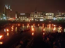A circle of fires shimmer in the Waterpark Basin in downtown Providence last Saturday at the hub of a three-quarter-mile WaterFire "sculpture."