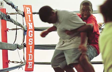 Youngsters release some energy in the boxing ring at the Winter Haven PAL complex Tuesday.