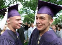 Martha's Vineyard Regional High School graduates Teddy Bennett, left, and Tyrone Barlosky after graduation at the Tabernacle in Oak Bluffs yesterday. More than 600 people watched the 150 seniors in the class of 2000 get their diplomas.