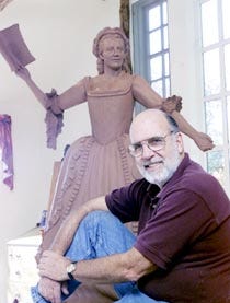 David Lewis with a sculpture of Barnstable patriot Mercy Otis Warren that is nearing completion for the Barnstable County Courthouse.