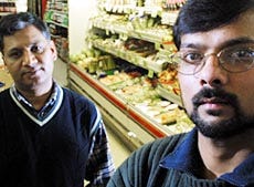 Chetan Patel, right, and his brother-in-law Rohit Patel, at their family-owned Pocasset County Market in Pocasset, have family in Ahmedabad, India, near the epicenter of last week's 7.9 magnitude earthquake.