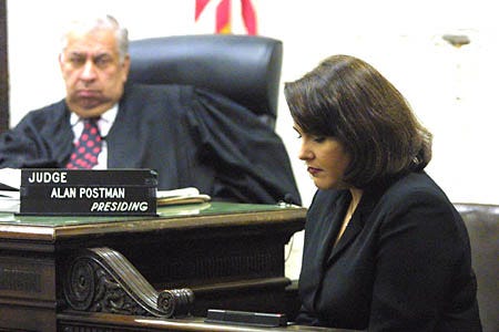 Ana Margarita Martinez, ex-wife of Cuban spy Juan Pablo Roque, testifies Tuesday in Miami before Miami-Circuit Court Judge Alan Postman. Martinez, who unwittingly married the Cuban double agent, testified Tuesday that she felt like a political pawn who was used by her husband and the Cuban government. She is seeking financial damages for being romanced and married to Roque as part of his official cover before he returned to Cuba in 1996.