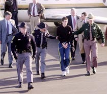 James Parker, 16, of Chelsea, Vt., is led in chains by state and Hanover, N.H., police yesterday at Lebanon, N.H., airport.