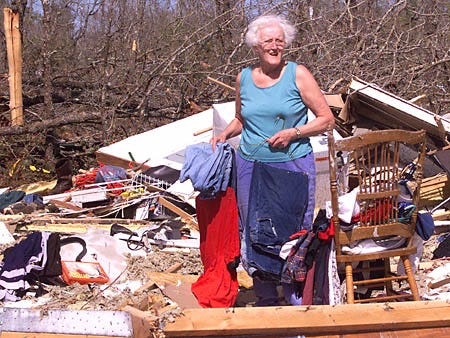 Gretchen Jensen, who lives near Wausau, searches through the remains of her son's mobile home, after a tornado destroyed it, Thursday, in Wausau. Severe storms, including at least one tornado, lashed the Florida Panhandle and southwestern Georgia early Thursday, killing one person, injuring more than a dozen others and toppling trees and mobile homes.