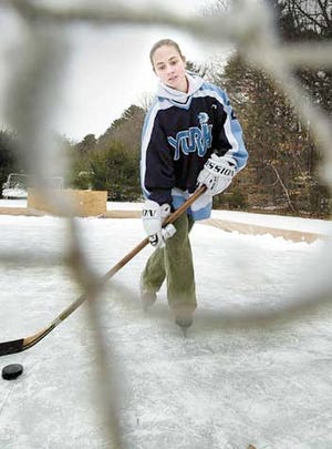 Becky Wacker, 17, is an outstanding player on the York High School Wildcats hockey team.
