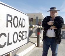 Eagle Gibbs of Sagamore is not happy that the road into Scusset Beach State Reservation in North Sagamore is now gated shut between 3:30 p.m. and 7:30 a.m. on weekdays. The state says it doesn't have the money to monitor the grounds 24 hours a day in the off-season.
