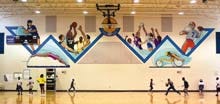 A sports-themed mural painted by Suzanne Marie Raveling inside the Martin Luther King Recreation Center off Waldo Road was funded by the City of Gainesville Art in Public Places Program.