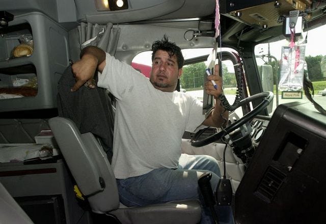 MIKE DERER/The Associated Press
Al Badri of Salt Lake City sits in the cab of his truck in Kearny, N.J. He thinks there are too many truckers for too little freight.