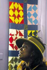 After a two-hour drive from Wilbraham, Mass., Yvonne Williams admires one of the family quilts on display at Sunday?s opening of the Seacoast African American Cultural Center in Portsmouth. The new center?s regular hours are 10 a.m. to 5 p.m. on Tuesdays and Thursdays, and 10 a.m. to 4 p.m. on Saturdays. For more information, call 436-7629 or 431-8290.