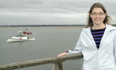NHEP Director Jennifer Hunter is shown at Hampton Harbor on Thursday afternoon, overlooking the clam flats.