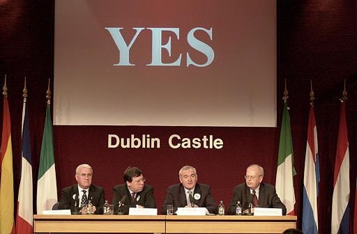 The Irish Prime Minister Bertie Ahern, second right, with members of his government, Dick Roche, Minister for European Affairs, Brian Cowan, Minister for Foreign Affairs, and Malcolm McDowell, right, Minister for Justice and Law Reform, speaking at a news confrence after the announcement of the Nice Referendum result at the Central Results Centre at Dublin Castle, Sunday after Ireland's vote for a Yes was passed in the referendum on the EU Treaty.