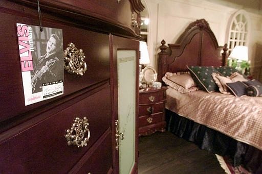 A tag indentifies the Elvis Presley's Graceland line of Vaughan-Bassett furniture company's bedroom furniture at the company's showroom in the International Home Furnishings Market in High Point, N.C., in this April 15, 2002, file photo. Elvis Presley is part of select group of dead celebrities with their own line of furniture.