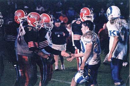 The combatants shake hands following the 1999 game at Wells.
