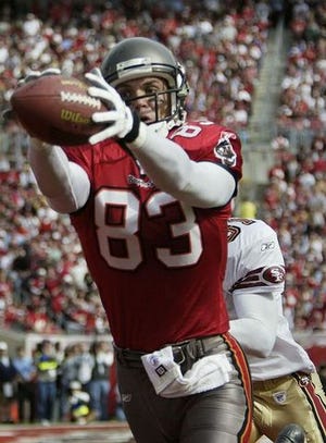 Joe Jurevicius, Tampa Bay tight end, grabs a pass from Brad Johnson for a second-quarter touchdown past the 49ers' Zack Brownson on Sunday.