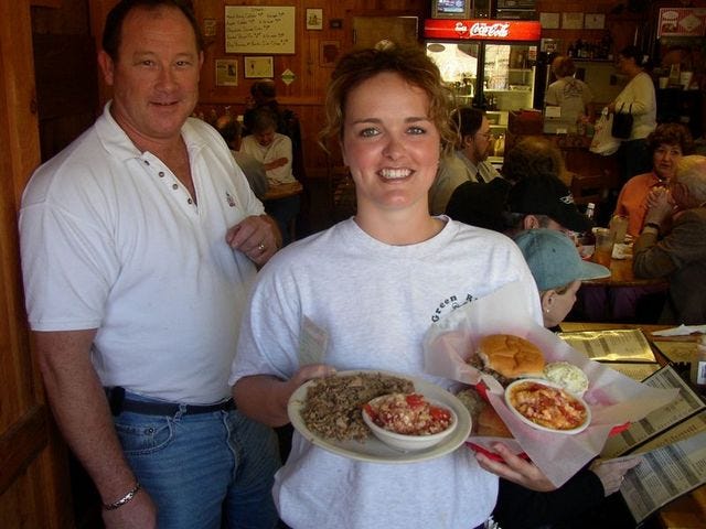 If it's Southern and it's barbecued, it's on the menu at Green River Bar-B-Que. Owner Kim Talbot, left, and server Casey Johnson show off a couple of the menu items, including "George's Special."