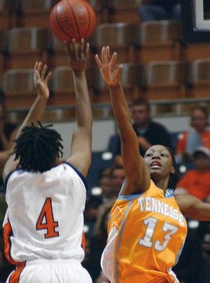 Auburn's Tia Miller has her shot blocked by Tennessee's Gwen Jackson in the second half on Sunday. Tennessee beat Auburn 59-56.