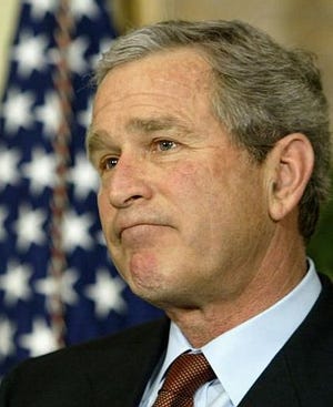 President Bush says he wouldn't be deterred by global protests against war with Iraq, speaking to reporters after a ceremony to swear in William H. Donaldson as the new Securities and Exchange Commission chairman at the White House in Washington, Tuesday, Feb. 18, 2003.