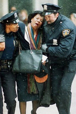 Two New York City police officers help an injured woman away from the scene near the World Trade Center after an explosion in this Feb. 26, 1993, file photo. A terrorist bomb killed six people and injured more than 1,000 others ten years ago. For many, that bombing has become the forgotten attack --overwhelmed by the carnage of Sept. 11, 2001, when hijacked airliners brought down the twin towers, killing nearly 2,800 people.