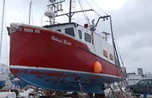 The fishing boat Rebecca Nicole, in dry dock at Kelley's Marina in Fairhaven, is undergoing repairs after a collision last week in waters off Chatham.