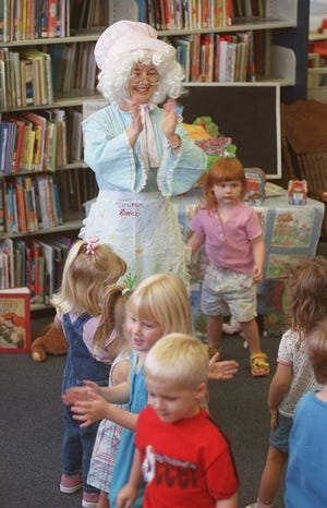 "Mother Goose" reads to an under-5 crowd at the Auburndale Public Library. Polk County is loaded with inexpensive or free activities for young children.