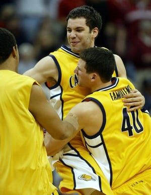 California's Richard Midgley, top, celebrates with teammate Conor Famulener after Midgley's threepointer led the Bears in Thursday's only overtime game in the NCAA Tournament.