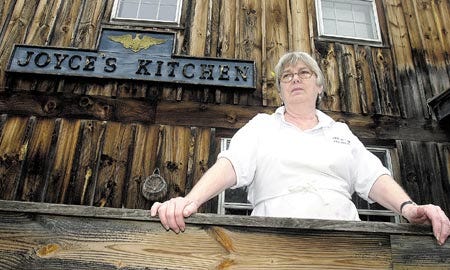 Joyce's Kitchen owner Joyce Russell stands outsider her Newmarket restaurant.