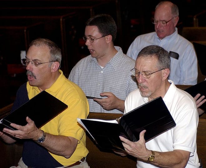 Skip Greathouse (from left), Richard Waters, Sonny Poston, David Smith, along with other men and women of the Lexington Choral Society, rehearse a song Monday evening at First Reformed United Church of Christ where two concerts will be performed in early May.