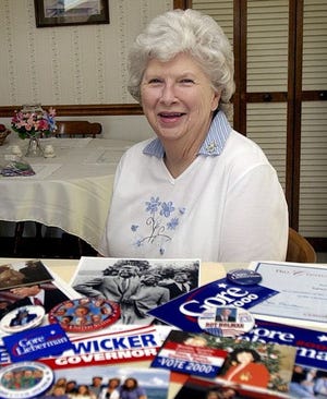 Laura Williams sits with some of the political memorabilia she has collected during her years with the Democratic Party serving as secretary of the local party and treasurer of the Democratic Women.