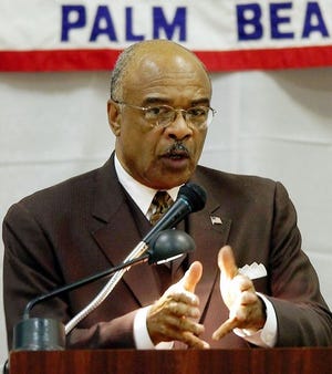 United States Education Secretary Rod Paige, speaks at the Forum Club of Palm Beach, Tuesday in West Palm Beach. Paige announced Tuesday that Florida's education system has been accepted under the president's No Child Left Behind plan.