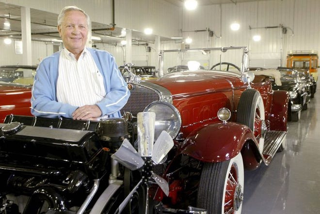 Jim Rogers poses behind a V16 engine from a 1931 Cadillac Roadster at the Sunbelt Auto Collection. Rogers said he bought the 1,800-lb., 16-cylinder engine from a man who had spent $37,000 restoring it.