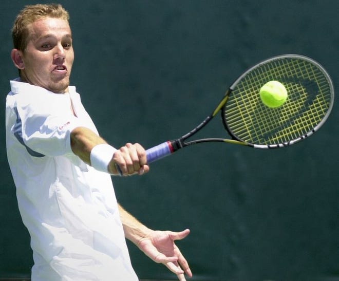 Chris McDonald hits a backhand during doubles play Sunday against Florida State.