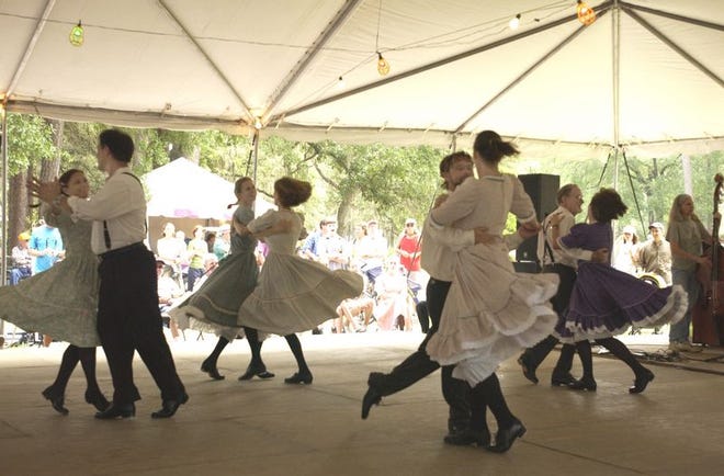 Members of the Cross Creek Cloggers perform at the Florida Folk Festival on Saturday at the 850-acre Stephen Foster Folk Culture Center State Park in White Springs.