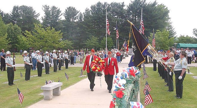 Members of the Marine Corps League, Blue Ridge Detachment, carry a wreath during a Memorial Day program at Forest Lawn Memorial Park.