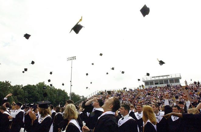 North Davidson High School 
seniors throw their caps in the 
air after being pronounced graduates during the graduation 
ceremony at the school Saturday morning.