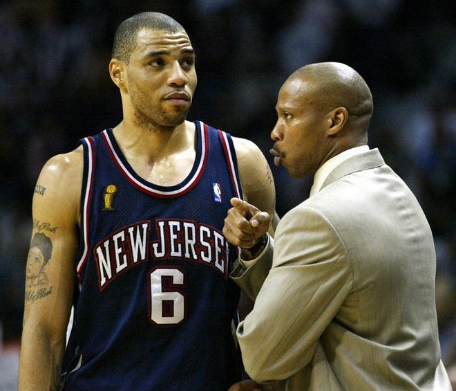 New Jersey coach Byron Scott, right, talks with forward Kenyon Martin during Game 1 of the NBA Finals against San Antonio on Wednesday. Many of Scott's decisions during the game are being questioned.